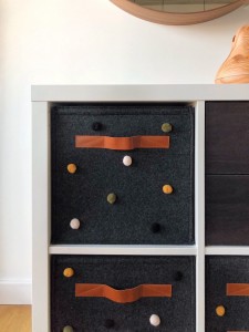 Colorful ball embellishments and square felt storage add customized fun to your space.